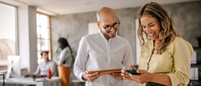 People collaborating around a table using Microsoft Copilot for business.
